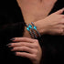 St. Ambrosia | .925 Sterling Silver | Turquoise Firefly Glass x Holographic Freshwater Pearl Cross Bracelet